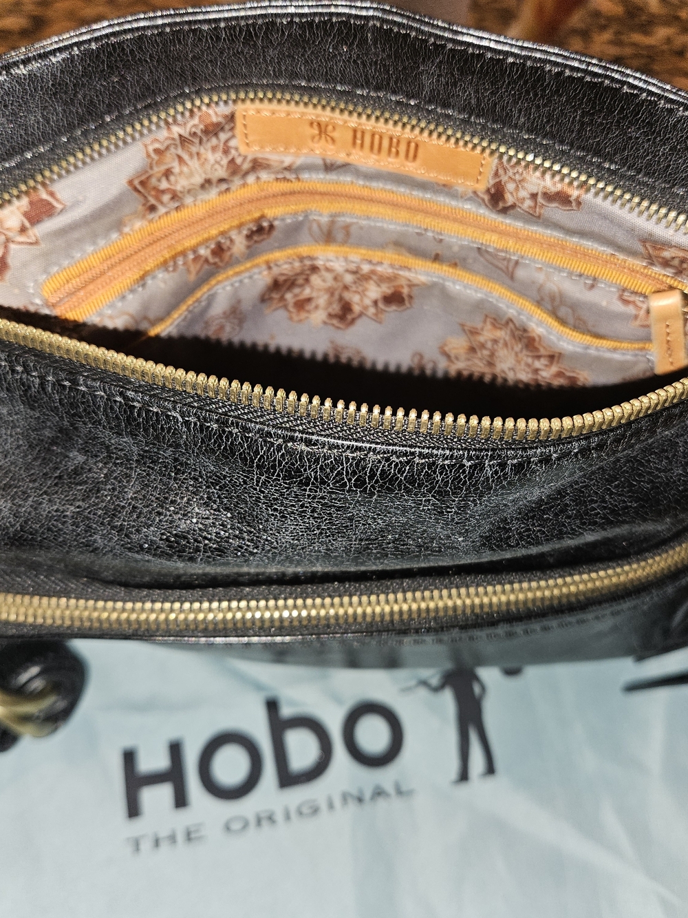 HOBO Black Leather Shoulder Bag with Gold-Tone Zippers
